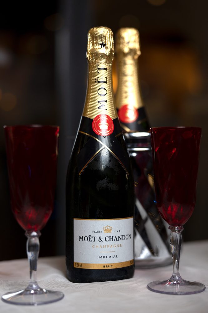 Chilled champagne and two red glasses ready for the toast